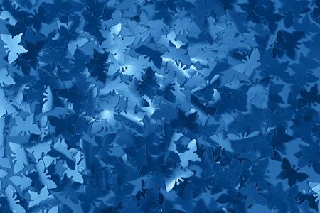 Abstract trendy blue butterfly shaped confetti background. Color of the year 2020 concept. Flat lay....
