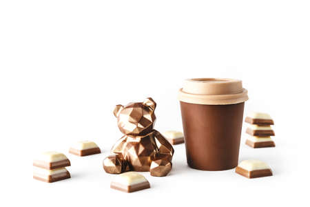 Beautiful chocolate bear with chocolate takeaway cup of coffee on isolated white background. Abstract design template on white backdrop. Food and drink concept. Coffee background. Copy space.の写真素材
