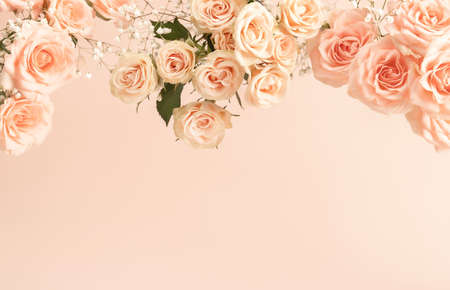 Beautiful pink tea roses on pastel background in retro style. Retro wedding invitation template for decoration design. Romantic holiday concept. Vintage pink gift card. Flat lay style. Copy space.の写真素材