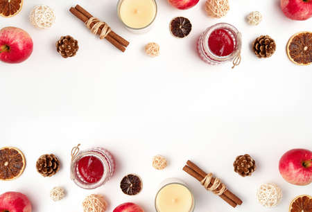 Autumn flat lay composition of apples, fall foods and decor on white background. Ingredients for jam...