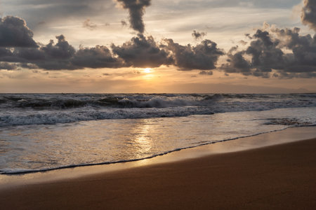 Sea splashing waves in the setting sun and beautiful cloudy sky background. Travel and tourism concept. Nature background. Great wallpaper design. Copy space.の写真素材