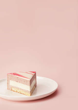 Delicious strawberry mousse cake slice with the layers and texture displayed on lilac background. Restaurant menu and confectionery concept. Close-up. Copy space.の写真素材