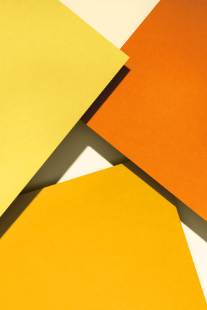Paper for pastel overlap in orange and yellow colors for background, banner, presentation template. Creative trendy background design in natural colors. Background in 3d style.の写真素材