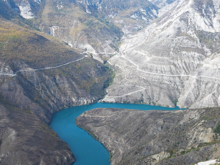 Breathtaking natural scenery of canyon, winding river of vivid turquoise, and mountain ranges. Natural background.の写真素材