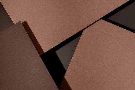 Abstract composition featuring layered paper textures in soft neutral tones, showcasing geometric shapes and shadows, creating a harmonious visual balance with ample copy space for design elementsの写真素材