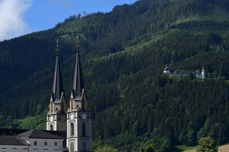 02.07.2022 Admont (Steirmark) - The towers of the Benedictine Abbey Church and RÃ¶thelstein Castle on the hilltopのeditorial素材