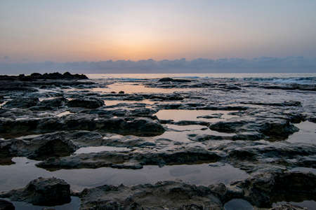 Beautiful view of beach or sea side with amazing waves. long exposure of sea and rocksの写真素材