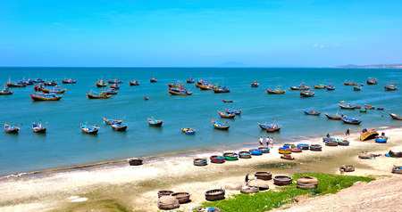 Landscape of fishing village Mui Ne, Phan Thiet, Vietnam, with a lot of boats along the blue coast.の写真素材