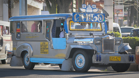 MANILA, PHILIPPINES - FEBRUARY 24, 2015. Jeepney on the street in Manila, Philippines. Jeepneys are the most popular means of public transportation in the Philippines.のeditorial素材
