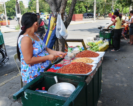 MANILA, PHILIPPINES - APR 27, 2014. Shoppers and vendors along one of the Divisoria's alley ways in Manila, Philippines. Divisoria open market is the country's largest.のeditorial素材