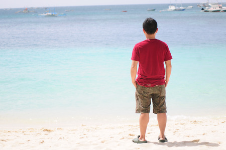 Boracay, Philippines - Feb 1, 2015. Tourists and traditional boat at White beach, Boracay Island, Philippines.のeditorial素材