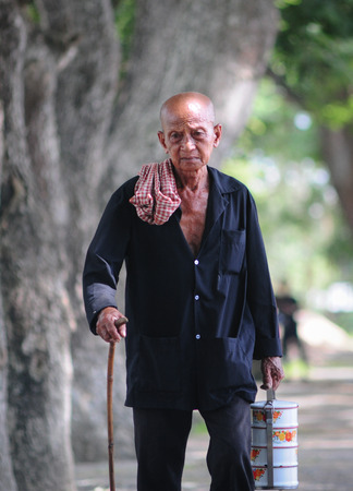 AN GIANG, VIETNAM JUL 3, 2014. Portrait of Vietnamese old man, senior male in tradition clothing of Mekong Delta zone, southern Vietnam.のeditorial素材