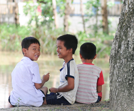 SAPA, VIETNAM - JUL 23, 2014. Ethnic Hmong children in Sapa, Vietnam. Hmong children often work on the field since childhood.のeditorial素材
