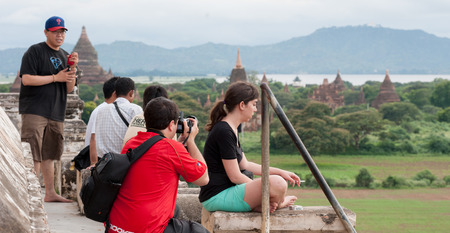BAGAN, MYANMAR - MAY 10, 2013. Travelers photographing temples at Bagan, Myanmar at sunset.のeditorial素材