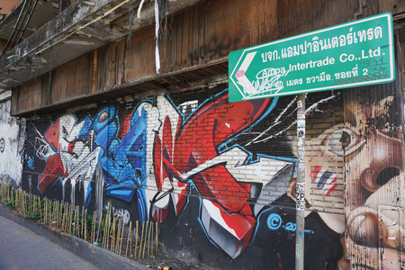 BANGKOK, THAILAND - SEPTEMBER 18, 2014. Giant graffiti on abandoned building of Bangkok in Bangkok, Thailand.のeditorial素材