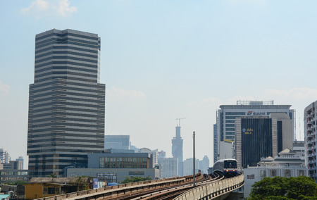 BANGKOK, THAILAND - NOVEMBER 23, 2014. View of street and sky train around Sathron junction in...