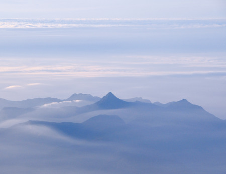 Mountain and clouds view from airplane.の写真素材