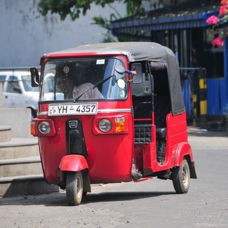 DAMBULLA, SRI LANKA - JANUARY 27, 2014. Auto rickshaw or tuk-tuk on the street of Dambulla. Most tuk-tuks in Sri Lanka are a slightly modified Indian Bajaj model, imported from India.のeditorial素材