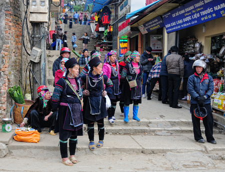 Hmong women in a traditional costume work on a market. Hmong people is a minority ethnic group living in Sapa.のeditorial素材