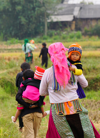 Hmong women in a traditional costume work on a market. Hmong people is a minority ethnic group living in Sapa.のeditorial素材