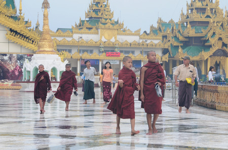 YANGON, MYANMAR - JAN 14, 2015: People visiting at Shwedagon Pagoda in Yangon, Myanmar. Shwedagon Pagoda is the most sacred Buddhist pagoda for the Burmese.のeditorial素材