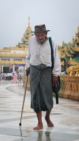 YANGON, MYANMAR - JAN 14, 2015: People visiting at Shwedagon Pagoda in Yangon, Myanmar. Shwedagon Pagoda is the most sacred Buddhist pagoda for the Burmese.のeditorial素材
