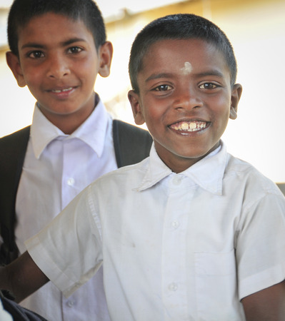 SIGIRIYA, SRI LANKA - FEBRUARY 28, 2015. Group of unidentified school students posing in train station after studying. のeditorial素材