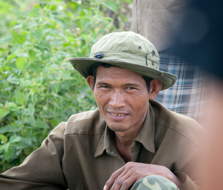 Mekong Delta, Vietnam - Mar 12, 2011. Portrait of Vietnamese farmer working on the rice field in southern Vietnam.のeditorial素材