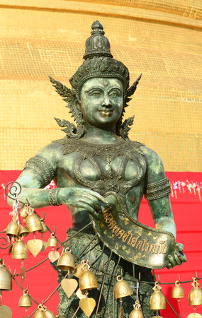 Angel statue with Golden stupa religious icon of Wat Saket golden mount in Bangkok of Thailand.のeditorial素材