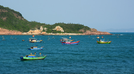 Nha Trang, Vietnam - Apr 20, 2015. Fishing boats and bamboo basket boats on beautiful beach in Nha Trang bay, Vietnam.のeditorial素材