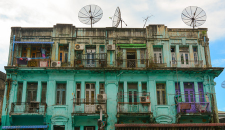 Yangon, Myanmar - Jan 14, 2015. Old residential building in Yangon, Myanmar. Century-old buildings with magnificent architecture are main tourist attraction in downtown Yangon.のeditorial素材