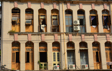 Yangon, Myanmar - Jan 14, 2015. Old residential building in Yangon, Myanmar. Century-old buildings with magnificent architecture are main tourist attraction in downtown Yangon.のeditorial素材