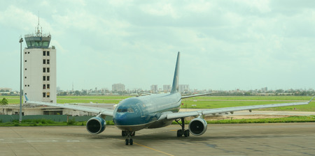 HO CHI MINH, VIETNAM - JUL 2, 2015. Civil aircrafts parking at Tan Son Nhat International airport in Saigon (Ho Chi Minh city), Vietnam. It is the international airport in southern Vietnam.のeditorial素材