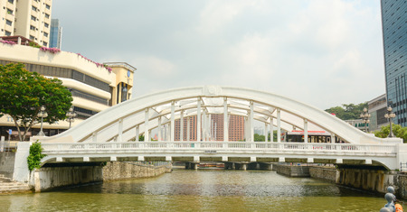 SINGAPORE - JUL 5, 2015. Elgin bridge, made in 1929, over the Singapore River in district Riverside. Bridges over the Singapore River are important in the city's infrastructure.のeditorial素材