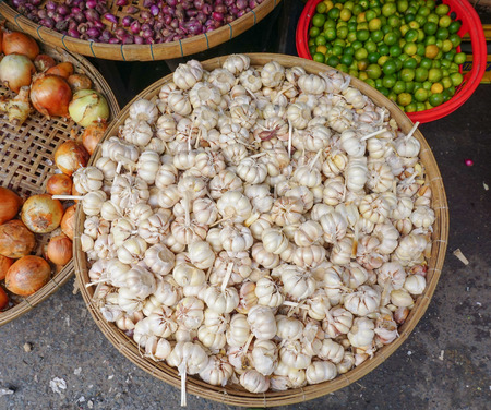 Close up of garlic on market stand in Mekong Delta, southern Vietnam.の写真素材