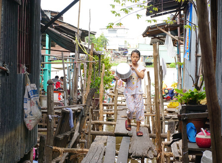 MY THO, VIETNAM - FEBRUARY 14, 2015. An unidentified girl at the house on the bank of Mekong river in My Tho, Vietnam.のeditorial素材