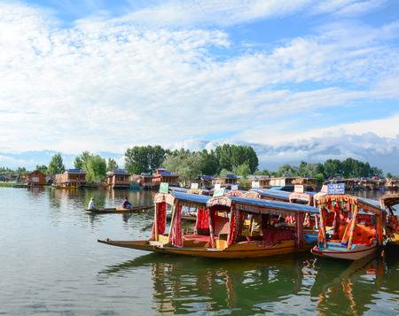 SRINAGAR, INDIA - JUL 21, 2015. Lifestyle in Dal lake, local people use 'Shikara', a small boat for transportation in the lake of Srinagar, Jammu and Kashmir state, India.のeditorial素材