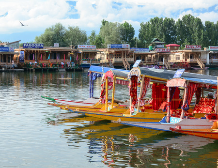 SRINAGAR, INDIA - JUL 21, 2015. Lifestyle in Dal lake, local people use 'Shikara', a small boat for transportation in the lake of Srinagar, Jammu and Kashmir state, India.のeditorial素材