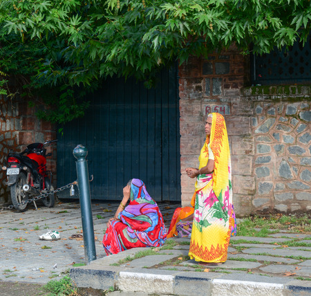 DELHI, INDIA - JUN 22, 2015. Indian women on street wearing traditional sari in Delhi, India. Saris are wrapped around the body, 4 to 8 metres in length.のeditorial素材