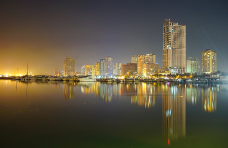 Manila, Philippines - May 11, 2015. Night view of Manila Bay and Manila Yacht Club from Harbour Square in Manila, Philippines.のeditorial素材