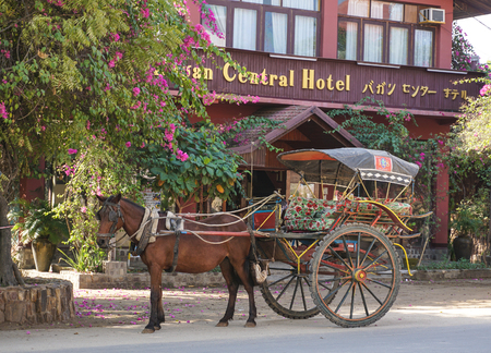 Mandalay, Myanmar - Jun 22, 2015. Horse carriage wait for tourist in Ava, Mandalay. The Ava Kingdom was the dominant kingdom that ruled upper Burma (Myanmar) from 1364 to 1555.のeditorial素材