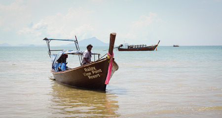 Krabi, Thailand - Sep 12, 2015. Tourist boat on the beautiful beach in sunny day in Krabi. Tourism is an important industry in Southern Thailand.のeditorial素材