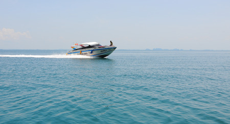 Krabi, Thailand - Sep 12, 2015. Tourist boat on the beautiful beach in sunny day in Krabi. Tourism is an important industry in Southern Thailand.のeditorial素材