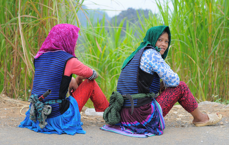 HA GIANG, VIETNAM - SEP 2, 2015. People sitting on countryside road after finish work in Ha Giang, north of Viet Nam.のeditorial素材