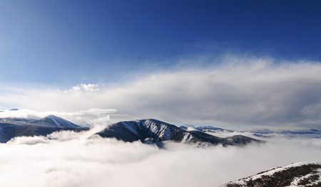 The clouds are flying over the snow mountain at Sichuan, China.の写真素材