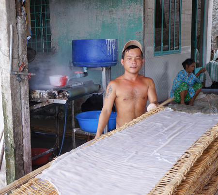 CAN THO, VIETNAM - NOV 10, 2014. Unidentified people making rice noodles in Mekong delta in Can Tho, Vietnam.のeditorial素材
