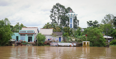 An Giang, Vietnam - Nov 30, 2014. Houses of local people staying along river in Mekong delta, southern Vietnam.のeditorial素材