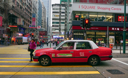 HONG KONG, CHINA - MARCH 19, 2015. Taxis on the street in Hong Kong. Over 90% daily travelers use public transport. Its the highest rank in the world.のeditorial素材