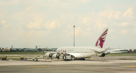 HO CHI MINH, VIETNAM - JUL 2, 2015. Qatar aircraft parking at Tan Son Nhat International airport in Saigon (Ho Chi Minh city), Vietnam. It is the international airport in southern Vietnam.のeditorial素材