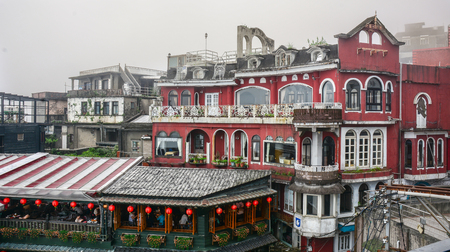 Jiufen,Taiwan - March 17, 2015. Hillside tea houses in Jiufen Taiwan, people can seen walking and...